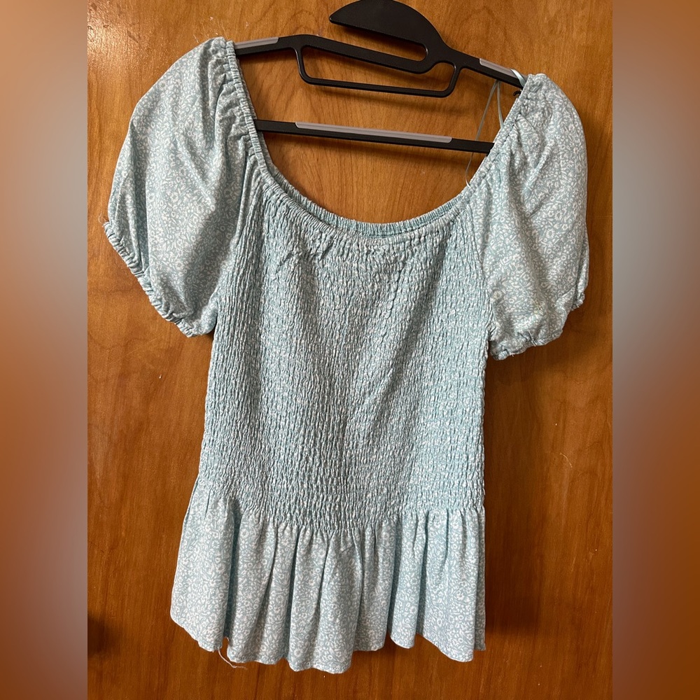 woman shirt off shoulders